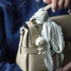 Hoptimist® Taschenanhänger beige